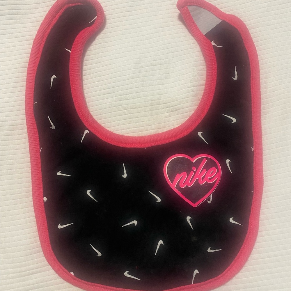 This is a beautiful black and pink bib.
